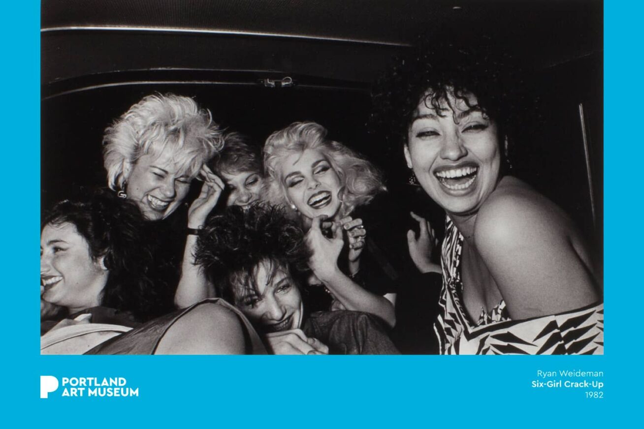 Black and white photograph of six people inside a vehicle.