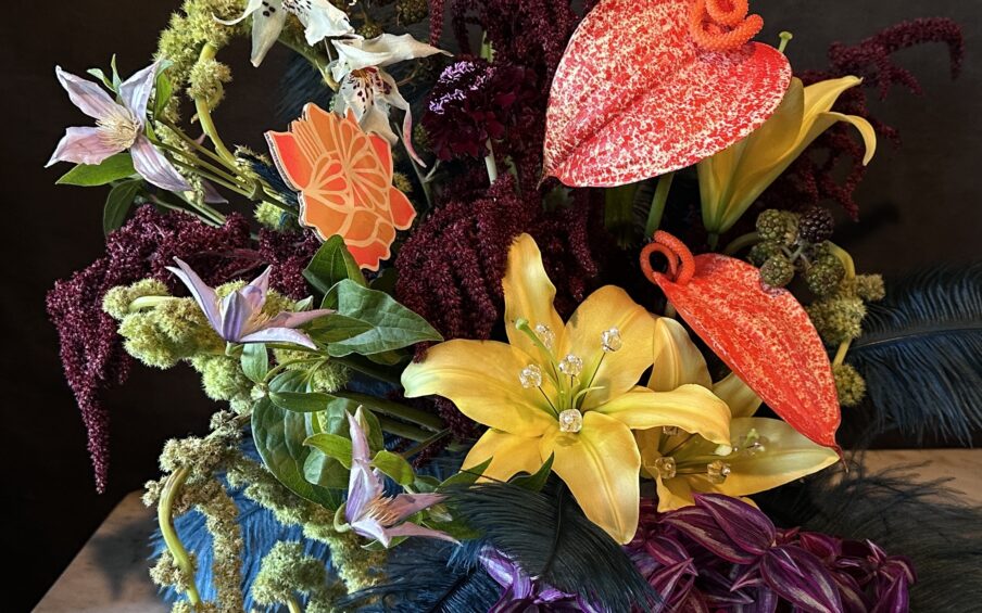 Photo of a flower arrangement against a black background.