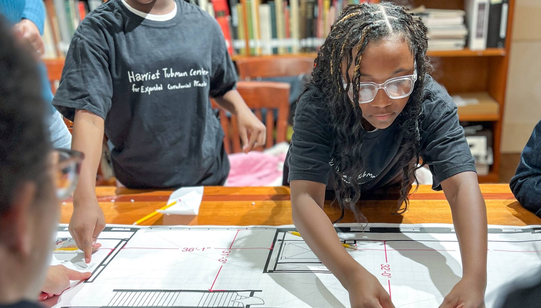 A young person working at a table.