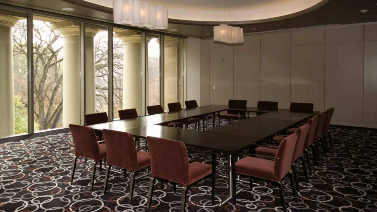 Room with multiple tables and chairs.