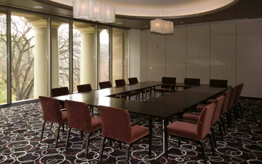 Room with multiple tables and chairs.