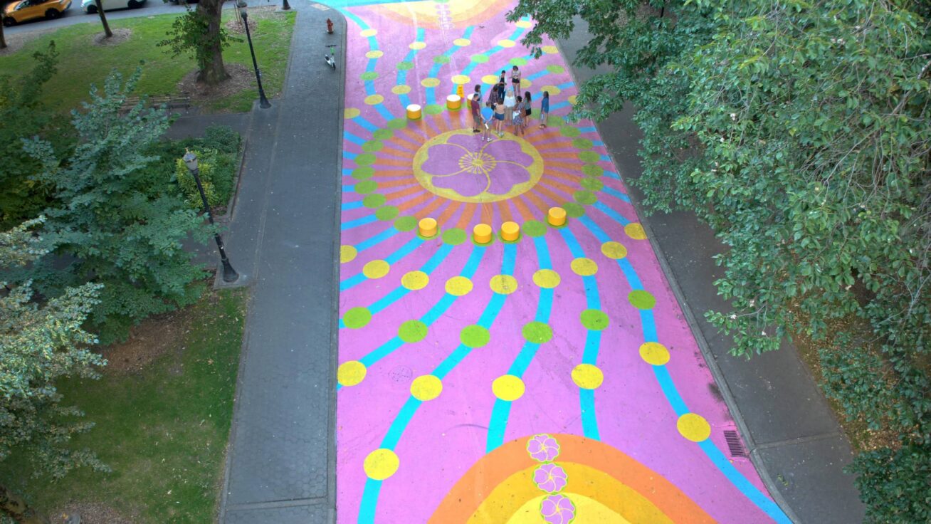 Colorful mural on a walking path.