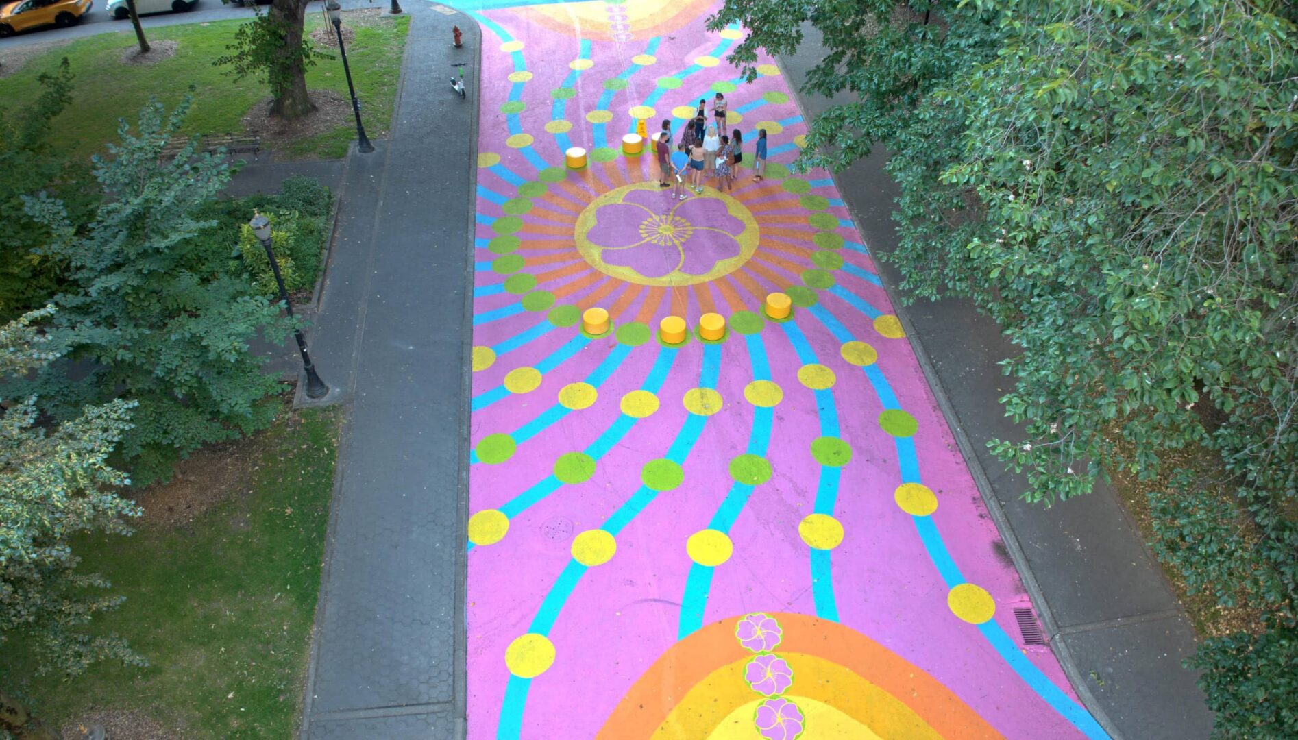 Colorful mural on a walking path.
