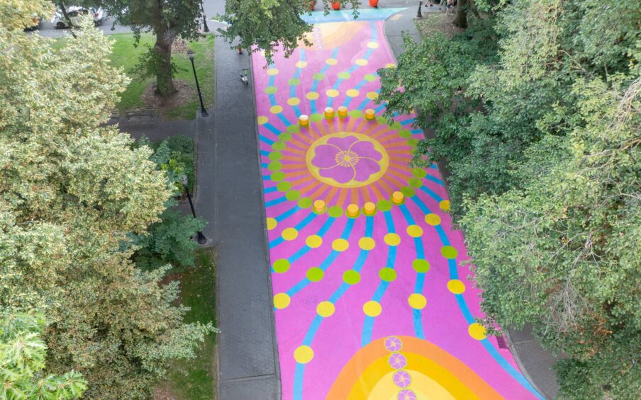 Colorful mural on a walking path.