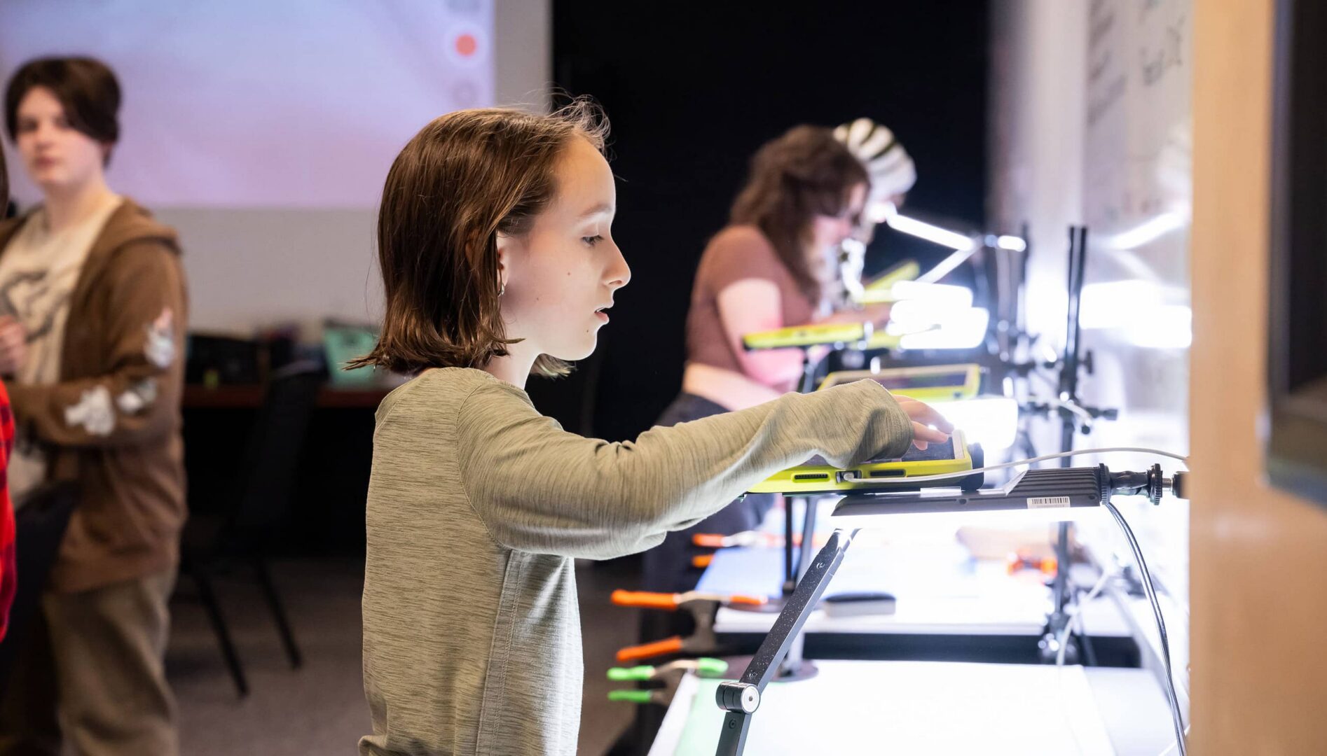 Young people working with animation equipment.