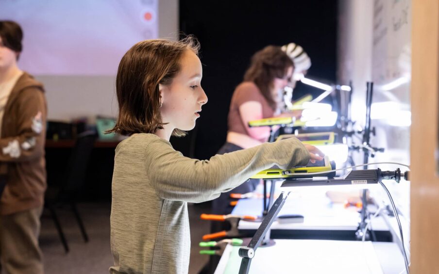 Young people working with animation equipment.