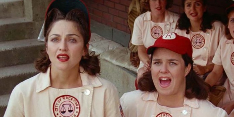 Two women in baseball uniforms.