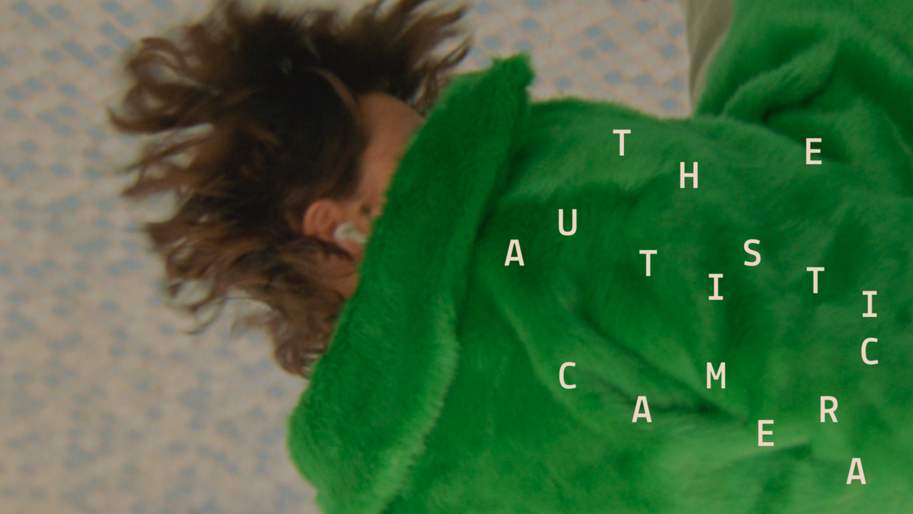 Photo of a person in a green coat laying on the floor.