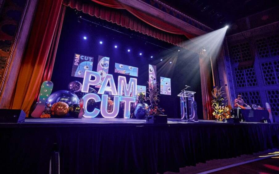 Stage with PAM CUT and spotlight on it