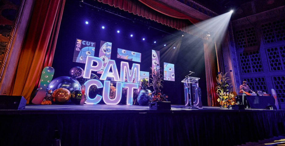 Stage with PAM CUT and spotlight on it