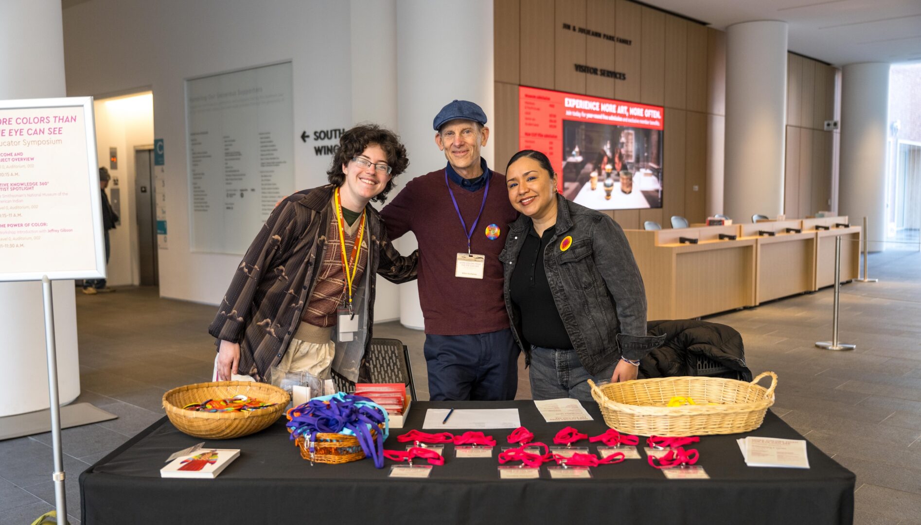 Learning Guide Apollo Beaber and PAM Educator Advisory Members Allen Koshewa and Dora Lisa Chavez welcome educators to MORE COLORS THAN THE EYE CAN SEE Educator Symposium in March 2026. Photo by Keith Scott.