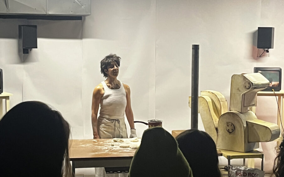 A person dressed like Nicolas Cage in Moonstruck performing in front of an audience.