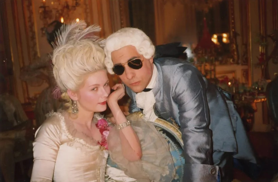 Photo of two actors behind the scenes of the Marie Antoinette movie.