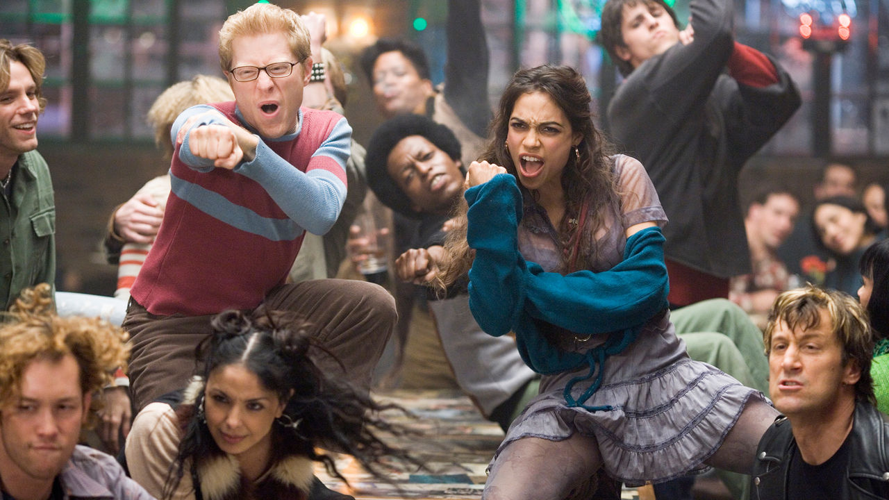 Film still from Rent where a group of people are dancing.
