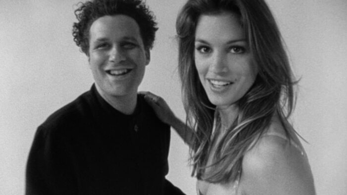 Black and white film still of Isaac Mizrahi and Cindy Crawford.