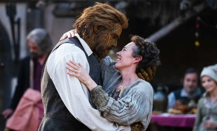 Film still from Wicker of a woman embracing a man made of wicker.