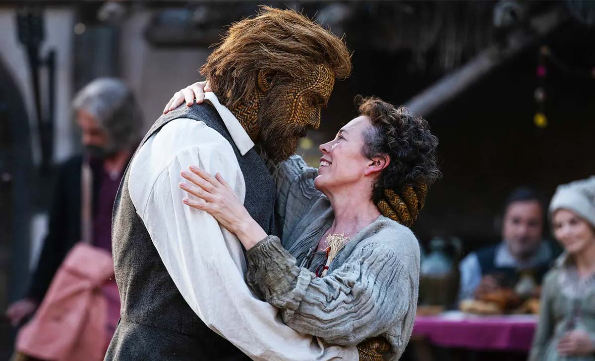 Film still from Wicker of a woman embracing a man made of wicker.